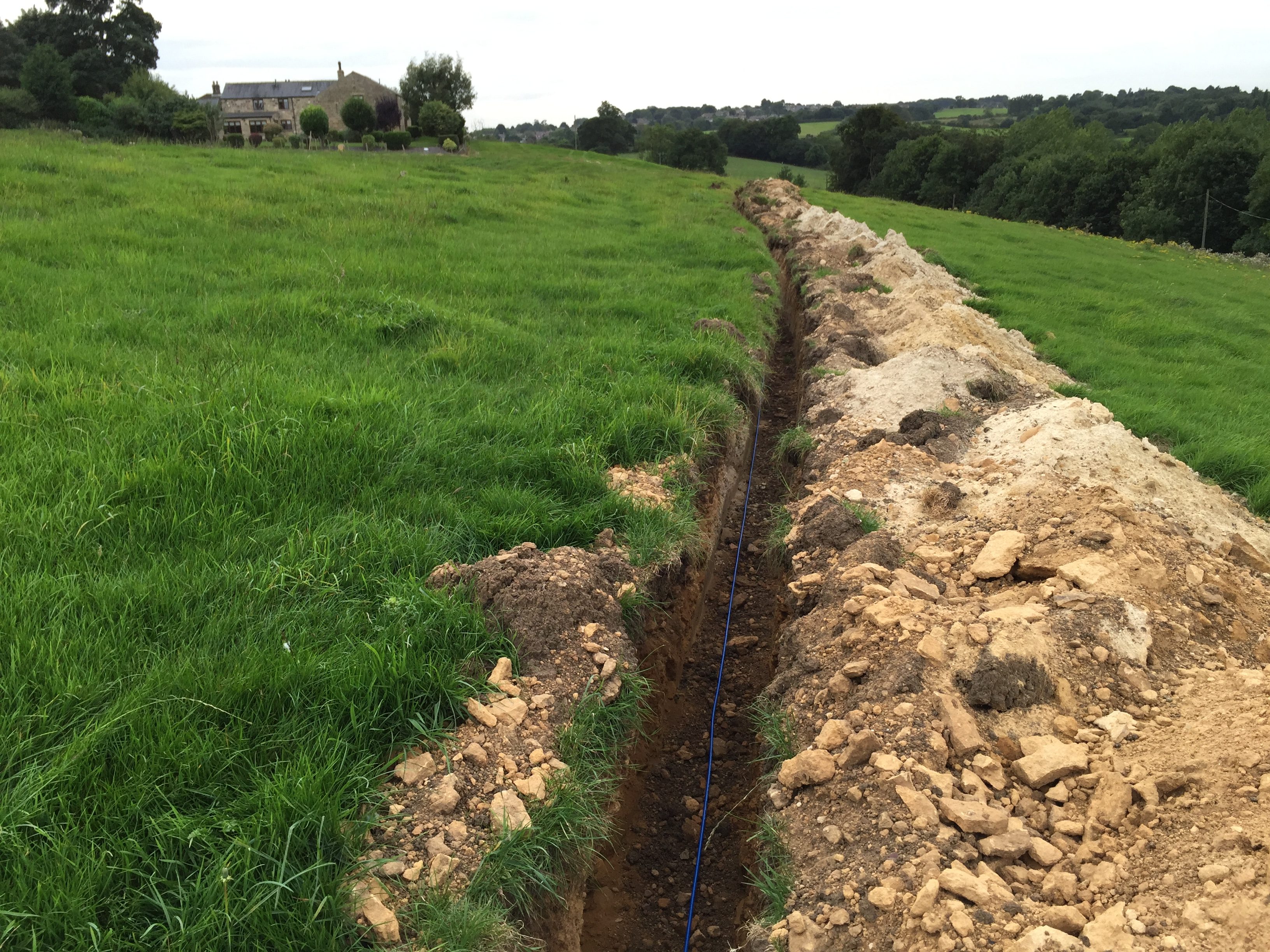 Trench dug leading to a farm in rural Eltofts